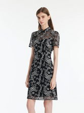a lady in a black floral embroidery cheongsam mini qipao dress